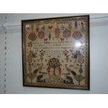 A large framed Victorian Sampler featuring Adam and Eve figures, floral motifs, exotic birds,