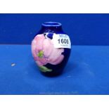 A small Moorcroft 'magnolia' vase,