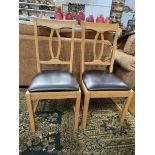 A set of eight contemporary Oak framed Dining Chairs having very dark brown/black upholstered seats