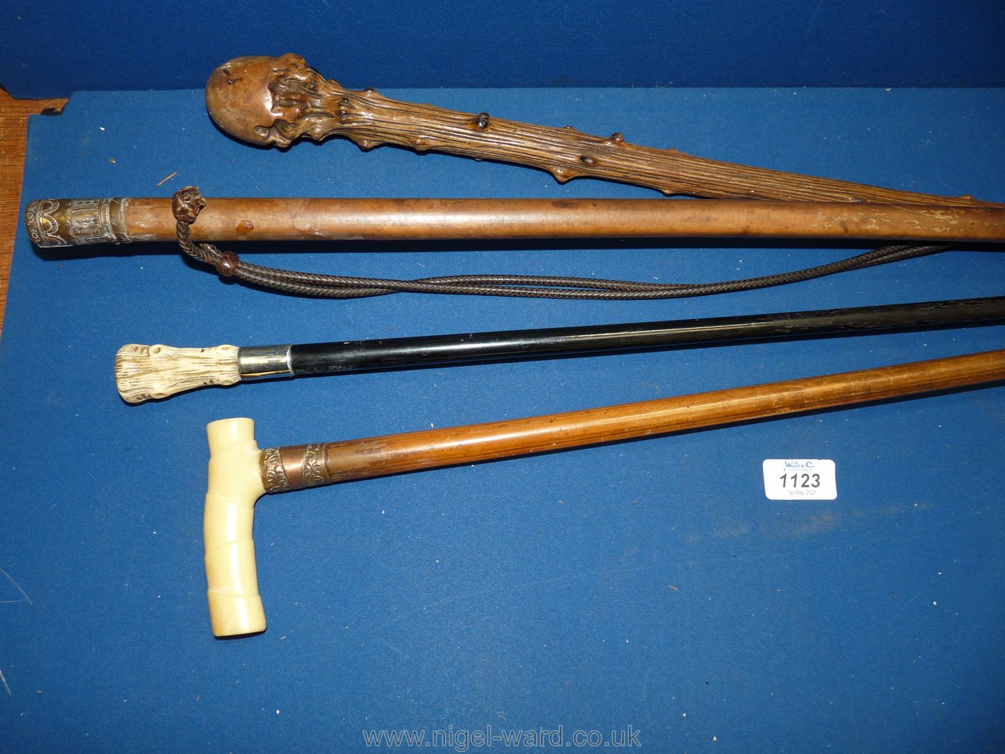 Four walking canes including one with leather thongs threaded through stick, copper collared, - Image 2 of 3