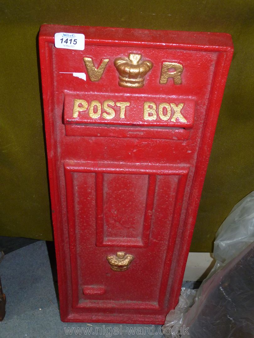 A contemporary red cast iron Letter box front marked V.R.