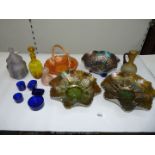 A quantity of coloured glass including Carnival glass dishes, perfume bottles,
