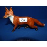 A Beswick standing fox, 9 3/4" x 5" tall.