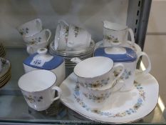 A Royal Doulton 'Pastorale' Teaset comprising six side plates, eight cups and saucers,