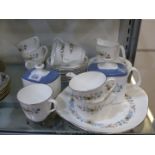 A Royal Doulton 'Pastorale' Teaset comprising six side plates, eight cups and saucers,