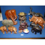 A large quantity of Elephant figures including wooden, black pottery, black leather,
