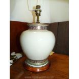 An elegant beige porcelain basedd table Lamp with gilt and polychrome friezes and of compressed