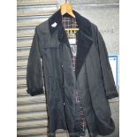 A Barbour trench coat in navy blue, size 40 long.