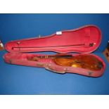 A cased Violin in a red case, no string, good bow,, 23'' long.