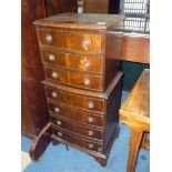 A tall compact Mahogany bow fronted Chest of three short over four short drawers,