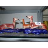 A pair of Staffordshire Greyhound pen holders, a/f,