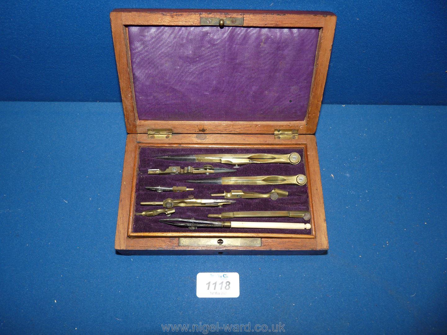 A Mahogany cased set of brass and ivory drawing instruments, box size 7 1/4'' x 4 3/8'' x 1 3/4''.