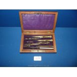 A Mahogany cased set of brass and ivory drawing instruments, box size 7 1/4'' x 4 3/8'' x 1 3/4''.