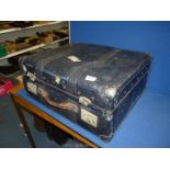 A large black Travel Case by "Rev-Robe, England" with fabric lining and met al rods to interior,