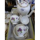 A coffee service possibly Hammersley decorated with violets including five coffee cans and saucers,