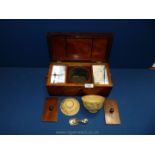 An Edwardian Walnut Tea Caddy with oval inlay to the lid with dove detail and lid opening to reveal