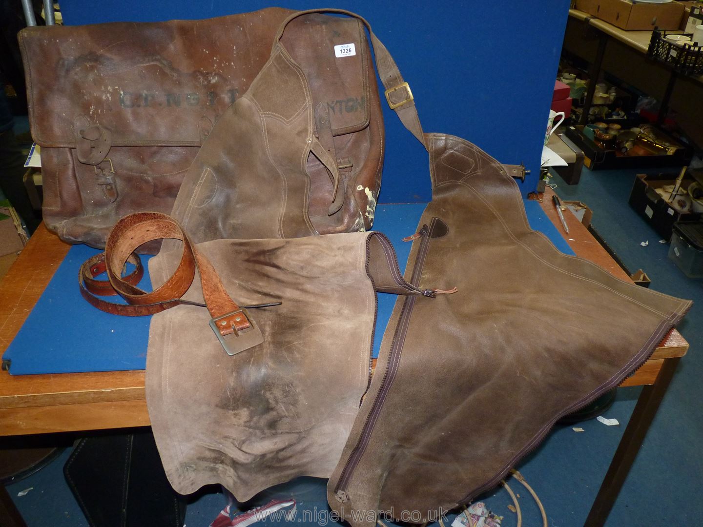 A pair of Vale of Belvoir chaps and a saddle bag marked G.