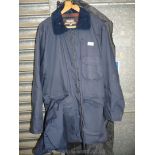 A gents dark navy waterproof 'Gelert Brecon' 3/4 length jacket with a tartan woolen lining, size L.