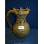 A Terracotta, bronzed effect Puzzle Jug.