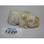 A Chinese white jade figure of a pig,