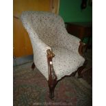 An elegant Victorian Walnut framed buttoned based Tub Armchair having elegant scroll front legs and