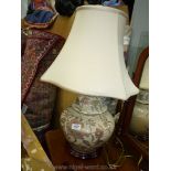 A Chinoiserie table Lamp in the form of a squat shaped lidded Ginger Jar of baluster shape,