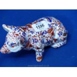 An oriental figure of a pig with floral decoration, 8'' long.
