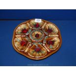 A Majolica Oyster dish in brown, red and blue, 10 1/2'' diameter.