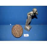 An Art Nouveau style heavy metal figure of a nude female and a risque female moulded pin tray.