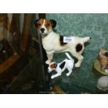 A large Jack Russell dog ornament, 6 1/2" tall and a Royal Doulton dog with slipper in mouth,