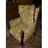 An elegant Mahogany framed light and darkwood strung and cross-banded Wing fireside Chair standing