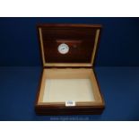 A polished wood Humidor box with groove detail to the sides and with a humidifier to the interior,