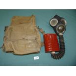 A WWII Bukta VI gas mask in canvas case dated 1940.
