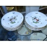 A set of twelve Herend hand painted dessert Plates with birds and butterflies etc.