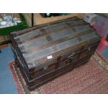 A domed top wooden strip protected Travelling Trunk 32 1/2'' x 18 1/2'' x 21'' high approx.
