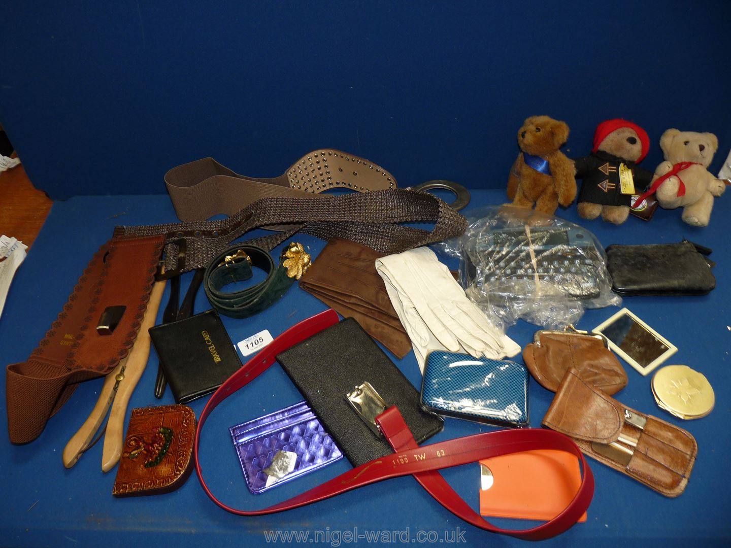 A quantity of miscellanea including leather gloves, belts, purses, little Teddy bears,