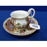 A 19th century Meissen cup and saucer attractively outside factory decorated with panels of gilding
