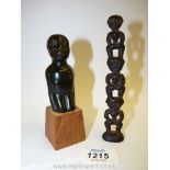 An interesting antique Bronze model totem in the form of men standing on one another's shoulders,