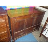 A good Oak three panel Coffer having a drawer to the base with brass swan neck drop handles and