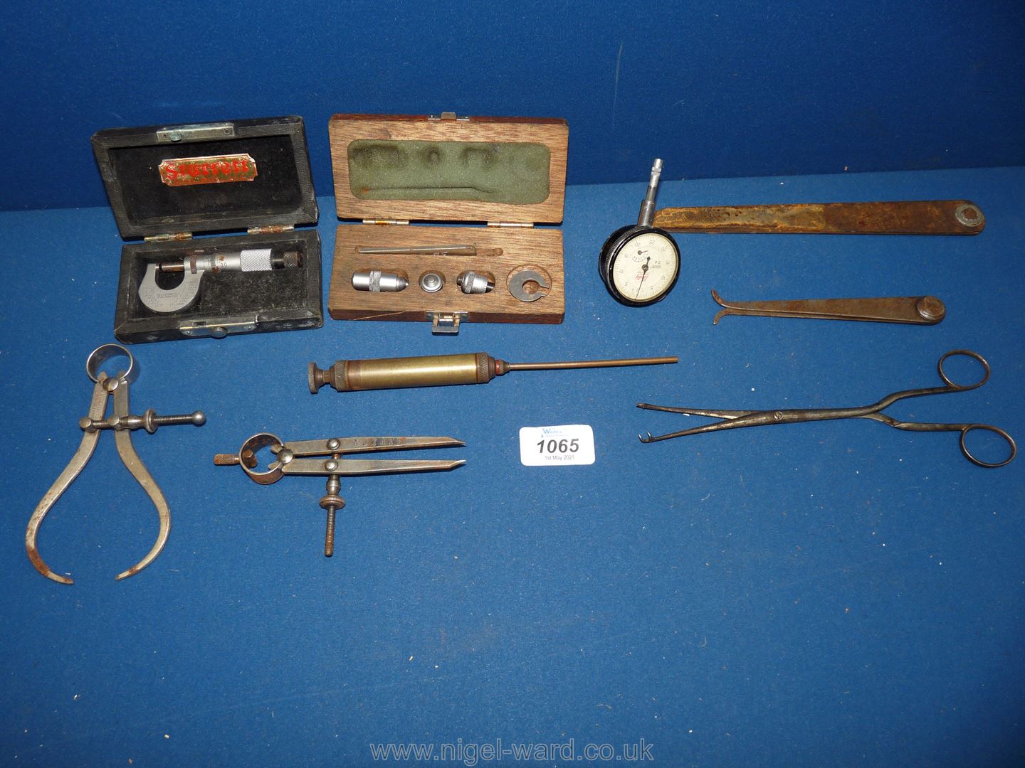 A quantity of tools including Starett micrometer, outside calipers, inside calipers, divider,