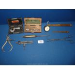 A quantity of tools including Starett micrometer, outside calipers, inside calipers, divider,