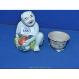 A fine and scarce Chinese porcelain figure of a small boy, one of the two heavenly twins,