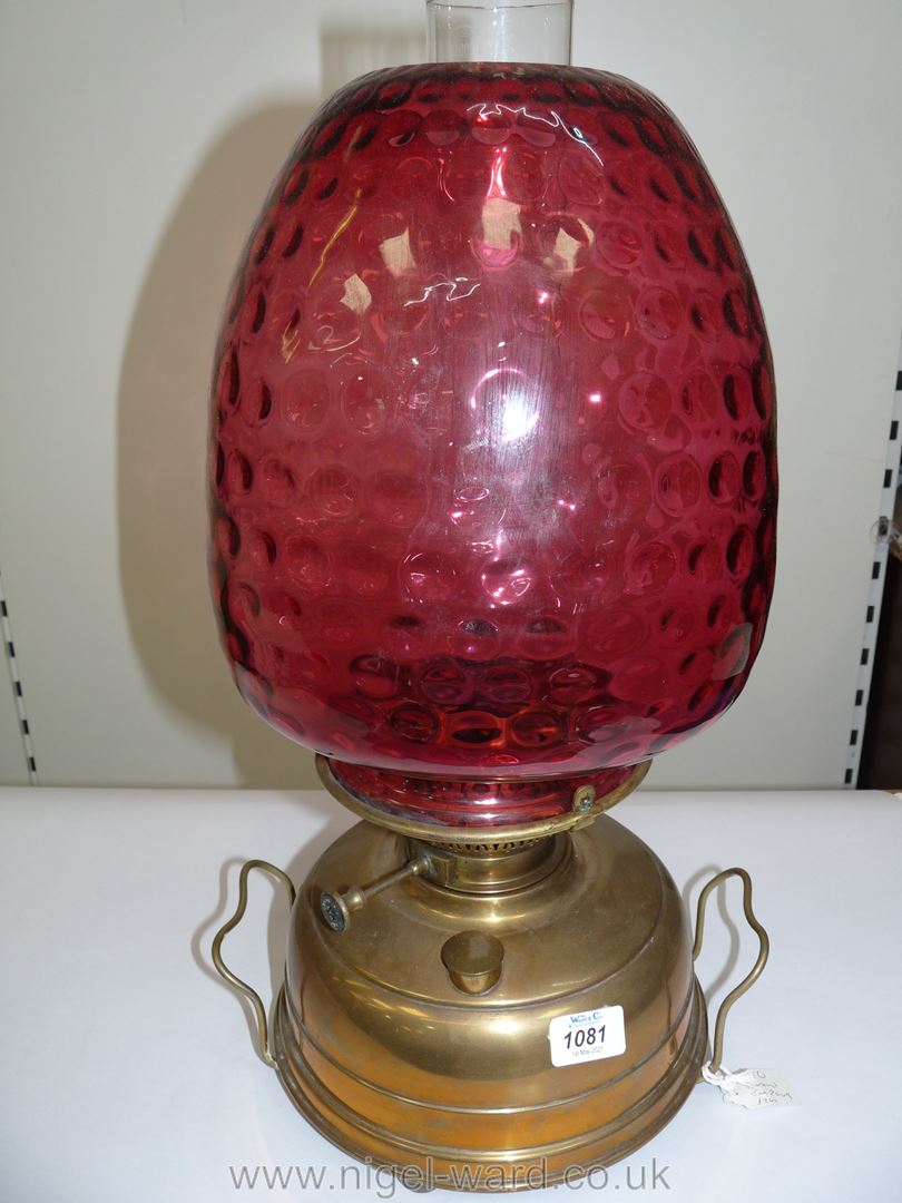 A Victorian Church oil/heater Lamp with squat brass base, having central draught,