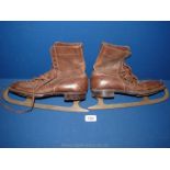 A pair of leather ice Skates/boots made by 'Marfield & Sons Ltd', blades made by 'John Wilson,