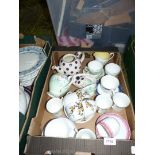 A box of china to include two teapots, tea cup and saucers (mixed), avocado dish, etc.