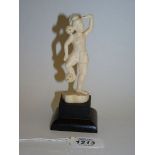 An antique Indian carved ivory figure of a juggler, c. 1900, 5 1/2" tall.