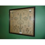 A framed Sampler featuring floral border, pair of birds and floral motifs, etc. worked by Sarah ....