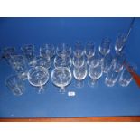 A box of glass including etched champagne flute, six fruit bowls, water tumblers, etc.
