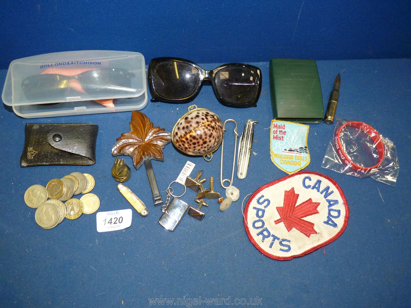 A small quantity of miscellanea including; a pair of Rayban sunglasses, souvenir bullet lighter,