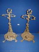A pair of Brass umbrella/stick Stands having four spade feet with a hunting horn,